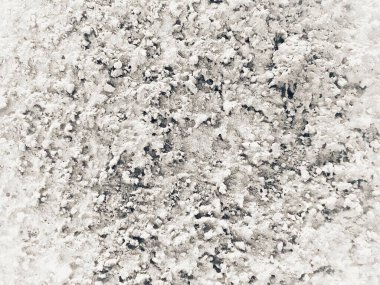 Close-up of rough cement wall surface with fresh texture, sharp details and natural pattern. Perfect for construction, masonry, architecture, industrial, and background themes.
