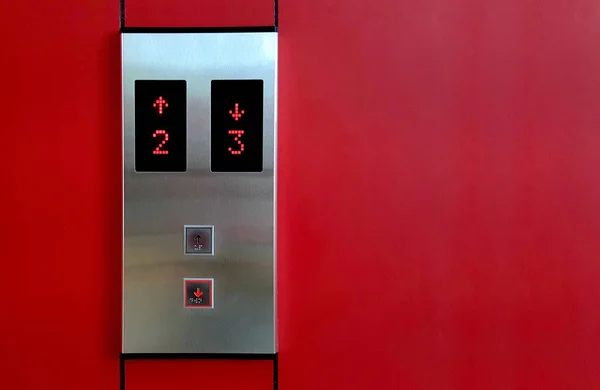 Elevator Button up and down direction with red light arrows. at office