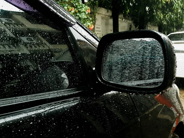 Rain on car mirror