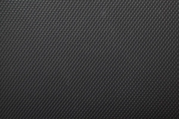 Black background of their woven rubber, textured. macro photography.