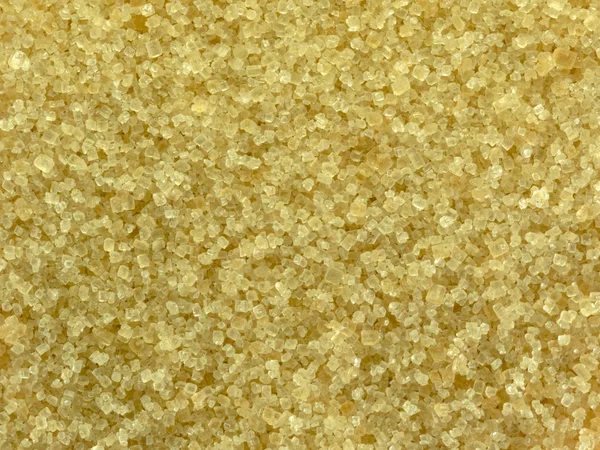 Close up of brown sugar texture. Natural sugar crystals for health. Delicious, glucose.