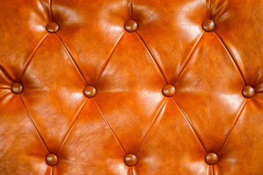 Turuncu deri kanepe arka plan. vintage stil ve geometri deseni