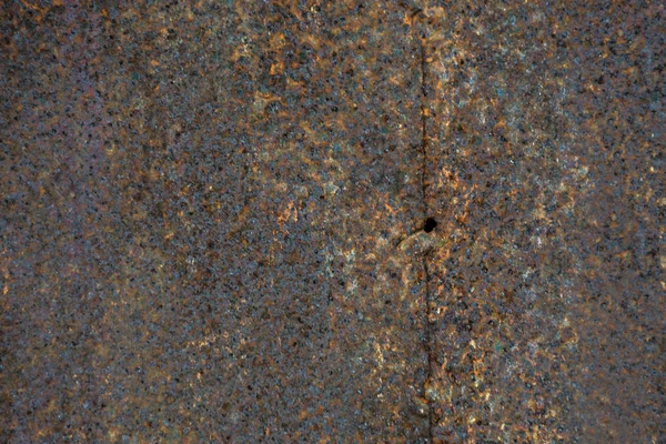 Textura plana enferrujada de aço com manchas de corrosão pesada. macro de volta — Fotografia de Stock