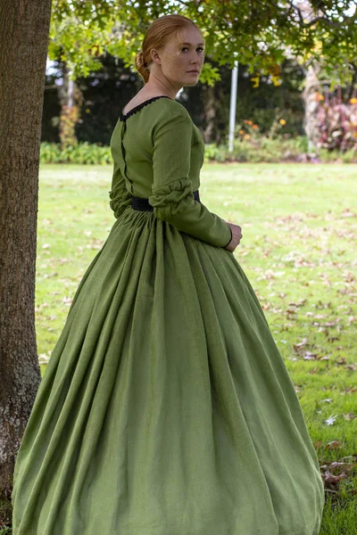 Victorian woman in green dress