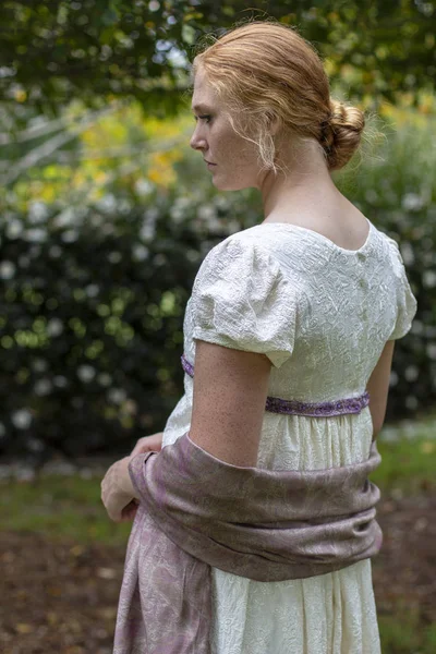 Regency woman in a cream dress
