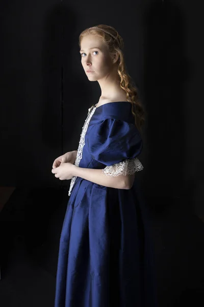 Renaissance woman in blue silk dress