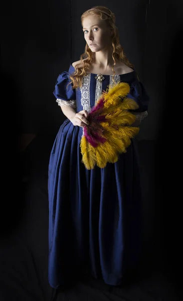 Renaissance woman in blue silk dress