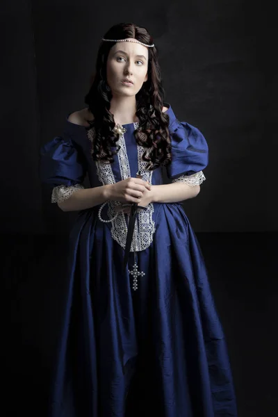 Renaissance woman in a blue silk dress