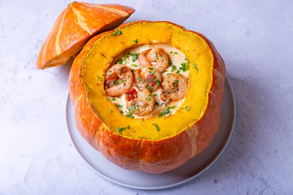 Pumpkin stuffed with shrimps and cheese, whole baked. Traditional Brazilian dish. Close-up. — Stock Image Pumpkin Stuffed Shrimps Cheese Whole Baked Traditional Brazilian Dish Close Stock Picture
