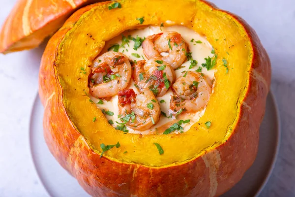 Pumpkin stuffed with shrimps and cheese, whole baked. Traditional Brazilian dish. Close-up. — Stock Image Pumpkin Stuffed Shrimps Cheese Whole Baked Traditional Brazilian Dish Close Royalty Free Stock Images