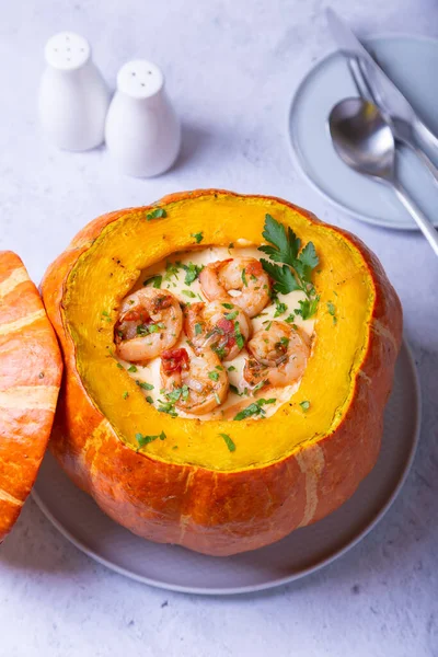 Pumpkin stuffed with shrimps and cheese, whole baked. Traditional Brazilian dish. Close-up. — Stock Image Pumpkin Stuffed Shrimps Cheese Whole Baked Traditional Brazilian Dish Close Royalty Free Stock Photos