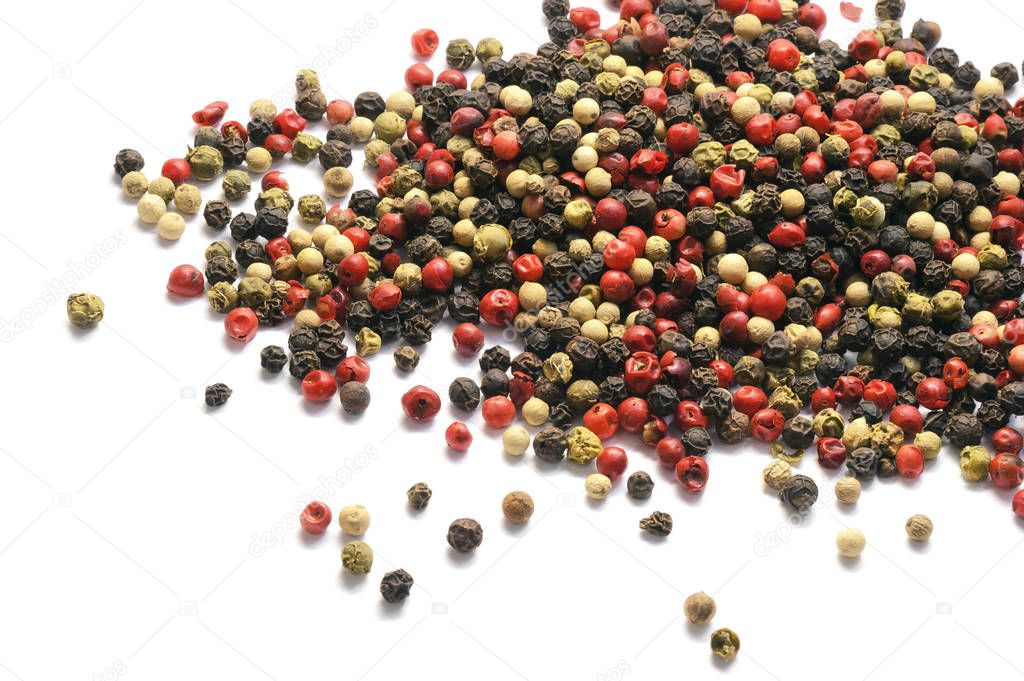Black, red and white pepper grains isolated on white. Spice. Food.