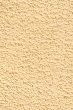 Yüzeysel desenli alçı duvarlar sarı renk.