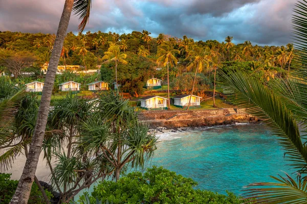 Sunset in holiday paradise resort on Grand Comore island, Comoros. Beautiful sunset light of sun going into the sea. Villas on the beach with private beach. Moroni Comoros, Itsandra beach resort hotel