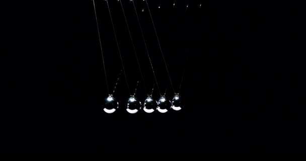 Pendulum Newton Cradle One Ball Hit Another Black Background Slow — стокове відео