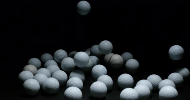 Golfbollar Mörk Bakgrund — Stockvideo