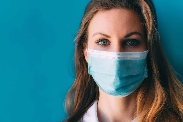 Close Portrait Young Female Doctor Medical Mask White Gown Blue — Stock Photo, Image