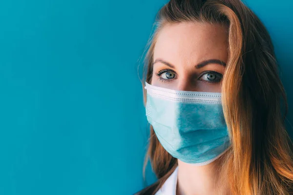 Close Portrait Young Female Doctor Medical Mask White Gown Blue — Stock Photo, Image