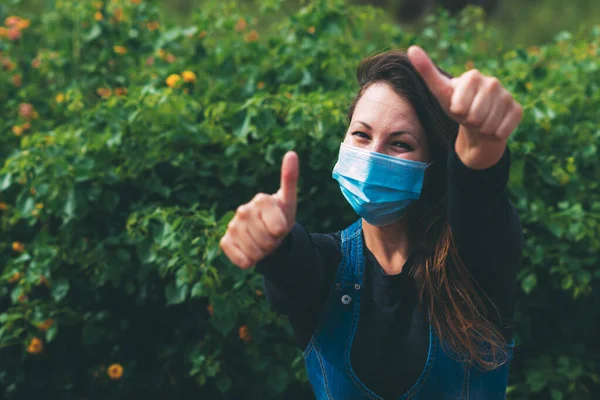 Young Woman Blue Medical Mask Rejoices End Quarantine Shows Her — Stock Photo, Image