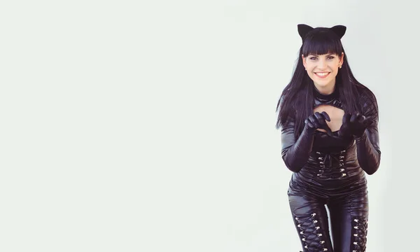 Costume of a beautiful young model wearing a cat costume. Hot sexy brunette cat-style female black fetish latex leather cat. Halloween isolated — Stock Photo, Image