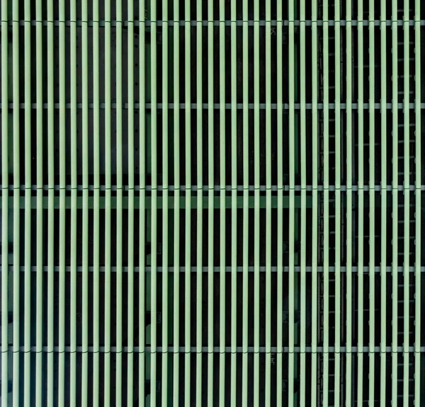 Green metal grill metal grid hole texture