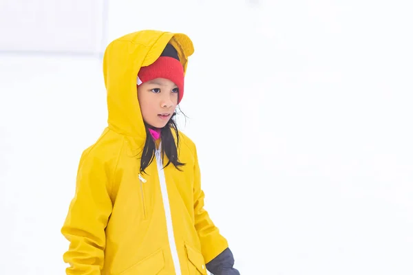 Portrait of Asian kid gril in yellow winter clothing — Stock Photo, Image