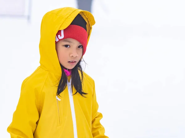 Portrait of Asian kid gril in yellow winter clothing — Stock Photo, Image