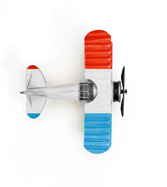 Государственный флаг Люксембурга путешествия Металлические игрушки самолет изолированы на ж — стоковое фото