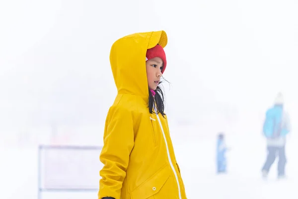 Portrait of Asian kid gril in yellow winter clothing — Stock Photo, Image
