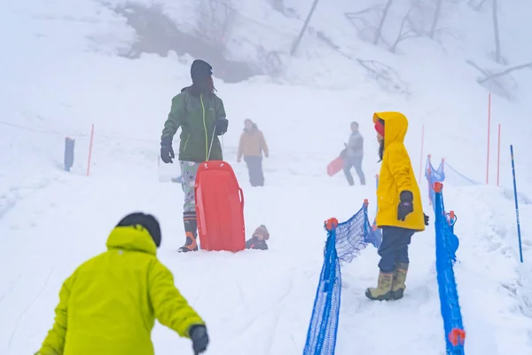 Tourist are playing with snow in Gala Yuzawa Ski resort. — Stock Photo, Image