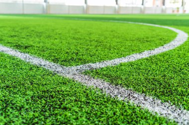 White round goal line on green grass for sport soccer field with nobody for background clipart