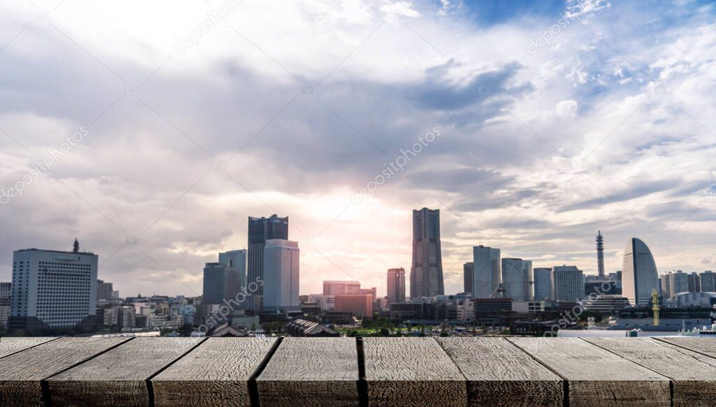 Empty display wooden board with copy space for advertising backdrop with modern city Yokohama skyline background