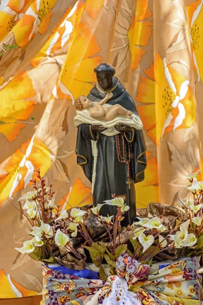 Saint Benedict, black-skinned saint carrying a child and traditional of the faith and Catholic religion of Brazil
