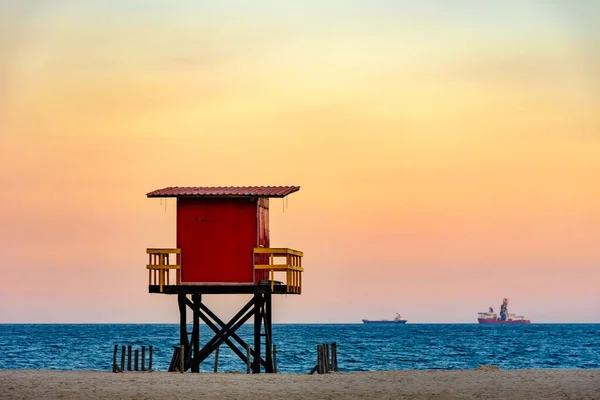 Rescue cabin on Copacabana beach at a tropical sunset on Rio de Janeiro city, Brazil