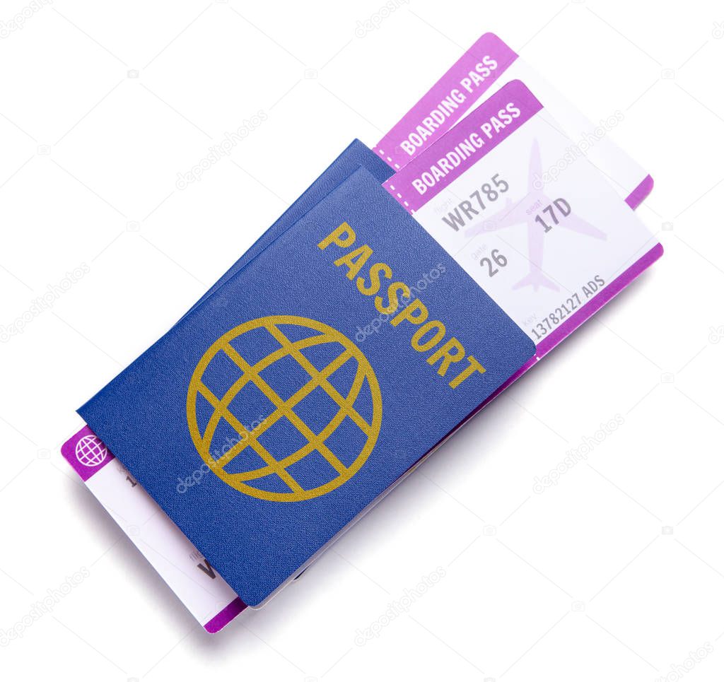 Two tickets for airplane with passports isolated on white background