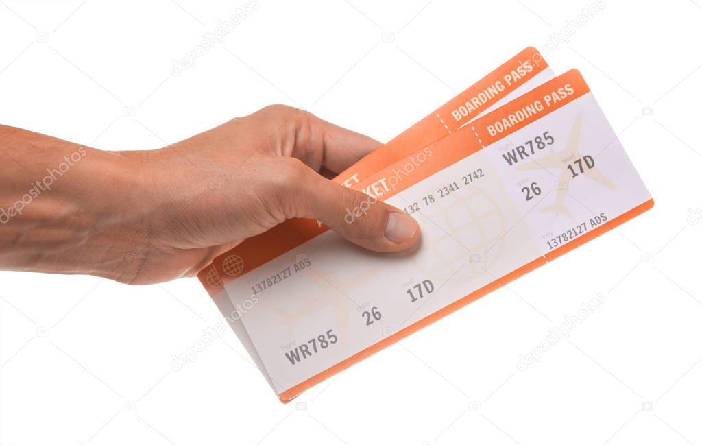 Man is holding two tickets for the airplane. Isolated on white background