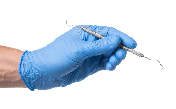 Doctor in blue glove holds dental hook probe in his hands. Isolated on white — Stock Photo, Image