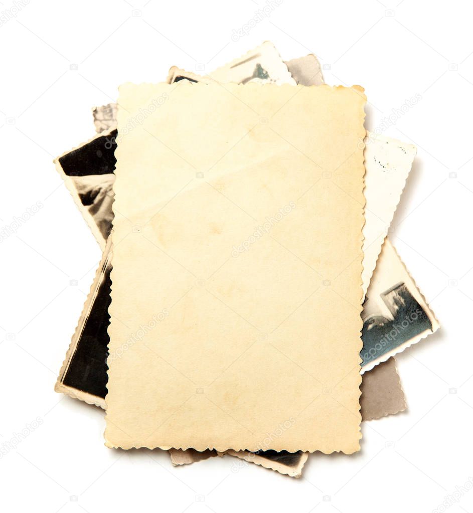 Stack old photos isolated on white background. Mock-up blank paper. Postcard rumpled and dirty vintage