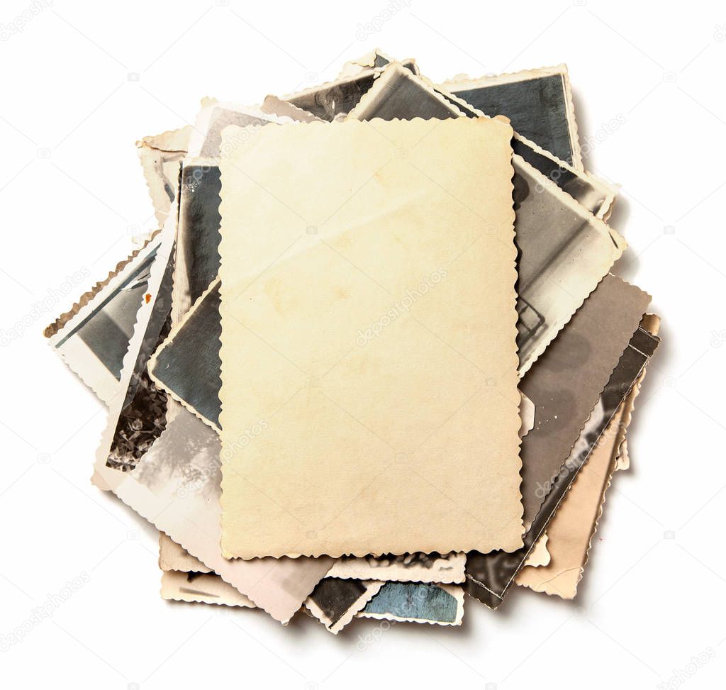 Stack old photos isolated on white background. Mock-up blank paper