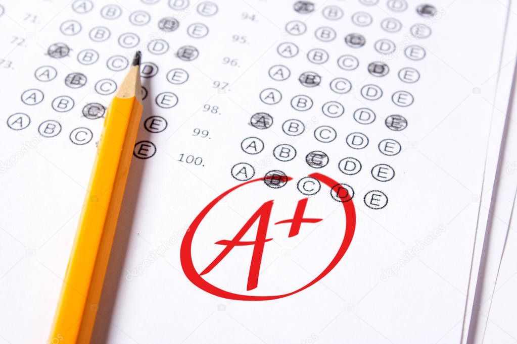 Good grade of A plus is written with  red pen on the tests.