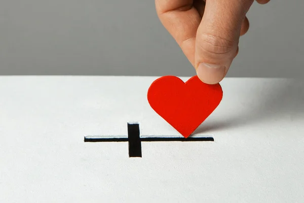 Donation of your heart as symbol of love for the religion of Christianity. Box for donations with slot in the form of christe — Stock Photo, Image