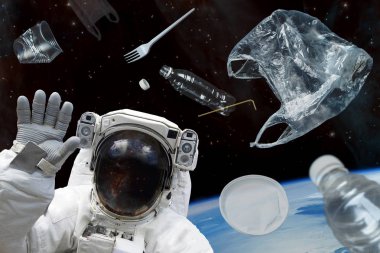 Uzay enkazı. Uzayda plastik enkaz ve bir astronot. Nasa tarafından döşenmiş bu görüntü unsurları