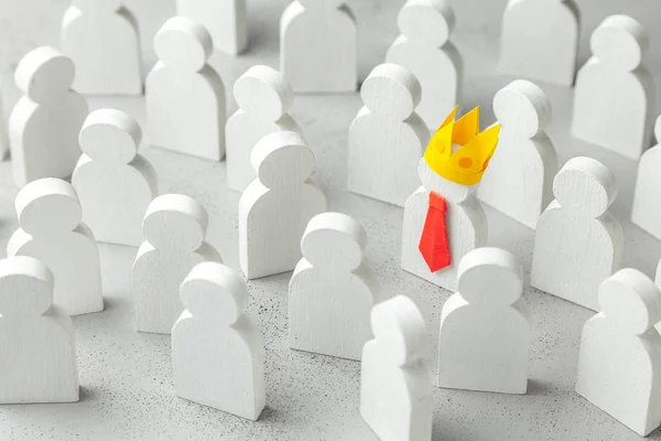 How to choose a leader from the crowd of staff. Lot of people and one special employee in red tie and crown. Staff recruitment