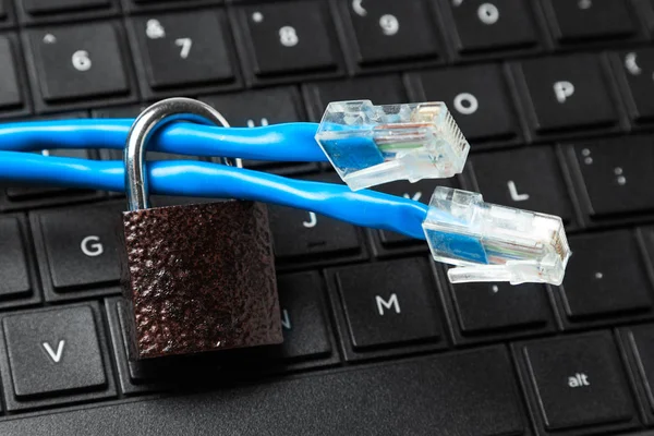 Restriction of access to the Internet. Cable twisted pair and lock on the keyboard of the laptop