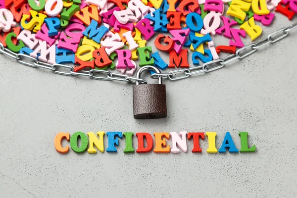 Closed confidential information. Letters of information symbol wrapped in chain and locked.