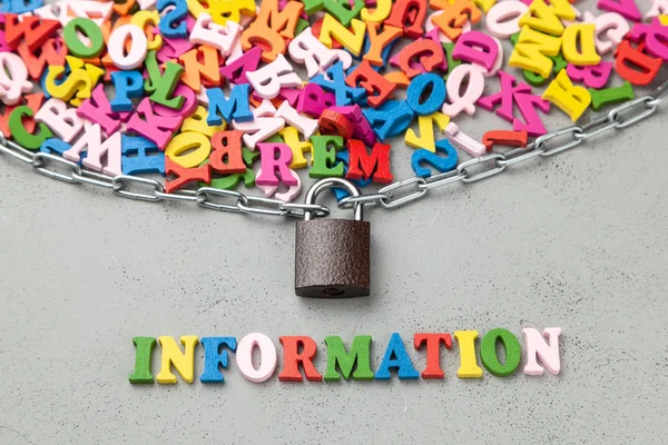 Closed or hidden information. Letters of information symbol wrapped in chain and locked.