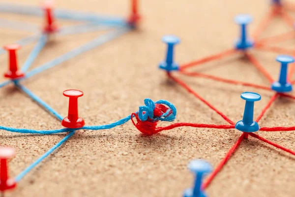 Business team. Connect between business people. Contract and negotiation. Office pins tied with blue and red thread and negotiated between businessmen