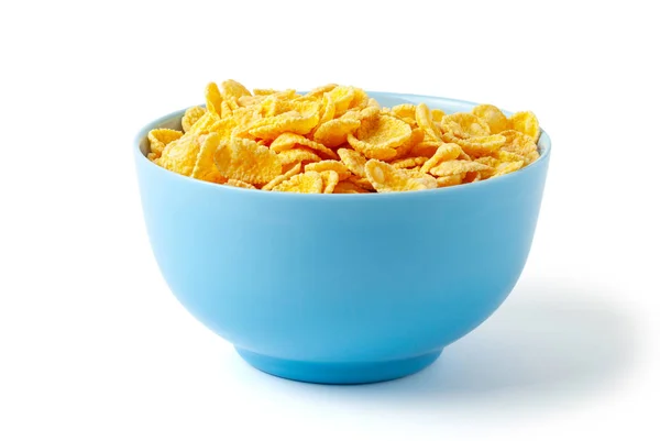 Colazione secca con cornflakes. Piatto blu pieno di cereali. Isolato su sfondo bianco . — Foto Stock