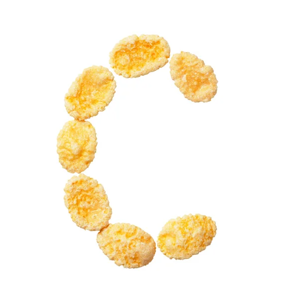 Yellow cornflakes letter C isolated on white background. Alphabet cereal flakes. — Stock Photo, Image