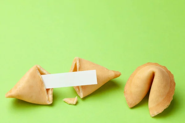 Chinese fortune cookies. Cookies with empty blank inside for prediction words. Green background Copy space for text. — Stock Photo, Image